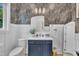 Stylish half bath with designer wallpaper, modern vanity, and elegant mirror at 800 Wilcox St, Raleigh, NC 27607