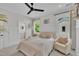 Bright bedroom with a ceiling fan, stylish decor, and an attached bathroom for added convenience at 800 Wilcox St, Raleigh, NC 27607