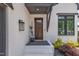 Inviting front entrance with a stylish dark wood door, modern lighting, and attractive landscaping at 800 Wilcox St, Raleigh, NC 27607