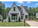 Beautiful home with a well-manicured lawn, classic white painted brick, and a charming architectural style at 800 Wilcox St, Raleigh, NC 27607