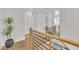 Bright hallway features hardwood floors, modern railings, and an inviting open layout at 800 Wilcox St, Raleigh, NC 27607