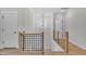 Upstairs landing with wood banister at 800 Wilcox St, Raleigh, NC 27607