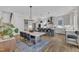 Open-concept kitchen featuring a center island, dining table, and stainless steel appliances at 800 Wilcox St, Raleigh, NC 27607