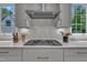 Gourmet kitchen features stainless KitchenAid appliances and tiled backsplash at 800 Wilcox St, Raleigh, NC 27607