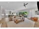 Open-concept living area with modern decor, hardwood floors, and a seamless connection to the kitchen at 800 Wilcox St, Raleigh, NC 27607