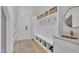 Mudroom with built-in storage cubbies, bench, and sink at 800 Wilcox St, Raleigh, NC 27607