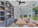 Bright office space featuring custom shelving, a modern table, and large windows for natural light at 800 Wilcox St, Raleigh, NC 27607