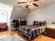 Cozy bedroom with a ceiling fan, desk, and an arched window for natural light at 820 Parkridge Dr, Clayton, NC 27527