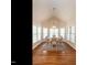Bright dining area with a vaulted ceiling, many windows, and wood floors at 820 Parkridge Dr, Clayton, NC 27527