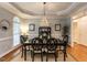 Elegant dining room with trey ceiling, chandelier, and hardwood floors at 820 Parkridge Dr, Clayton, NC 27527