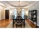 Elegant dining room with hardwood floors and wainscoting with lots of natural light at 820 Parkridge Dr, Clayton, NC 27527