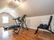 Home gym with exercise machines and wood flooring at 820 Parkridge Dr, Clayton, NC 27527