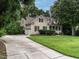 Traditional home featuring manicured lawn, long driveway and two-car garage at 820 Parkridge Dr, Clayton, NC 27527