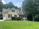Well-maintained home with green grass, attached garage and traditional siding at 820 Parkridge Dr, Clayton, NC 27527