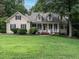 Charming home featuring a well-manicured lawn and a welcoming front porch at 820 Parkridge Dr, Clayton, NC 27527
