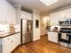 Spacious kitchen with stainless steel appliances, white cabinets, and dark countertops at 820 Parkridge Dr, Clayton, NC 27527