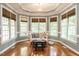 Bright sitting room with large windows, hardwood floors, and a cozy seating area at 820 Parkridge Dr, Clayton, NC 27527