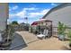 Fenced-in backyard featuring a concrete patio with a grill and sunshade at 85 Willard Wood Run, Benson, NC 27504