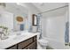Bathroom featuring a single vanity with dark wood cabinets and a shower tub at 85 Willard Wood Run, Benson, NC 27504