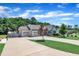 Spacious home with a three-car garage, long driveway, and manicured lawn at 85 Willard Wood Run, Benson, NC 27504