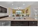 View of the kitchen island with a double sink and a view of the dining area at 85 Willard Wood Run, Benson, NC 27504