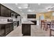 Stylish kitchen boasting dark cabinetry, stainless steel appliances, and a spacious island at 85 Willard Wood Run, Benson, NC 27504