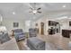 Open-concept layout featuring a living room with wood floors that connects to the kitchen at 85 Willard Wood Run, Benson, NC 27504
