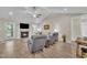 Comfortable living area with a fireplace, ceiling fan, wood floors, and neutral decor at 85 Willard Wood Run, Benson, NC 27504