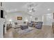 Inviting living room featuring a vaulted ceiling, fireplace, plush seating, and natural light at 85 Willard Wood Run, Benson, NC 27504
