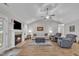 Bright living room featuring a fireplace, vaulted ceilings, and comfortable seating arrangement at 85 Willard Wood Run, Benson, NC 27504