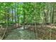 Wooded area with a decorative water feature in the natural setting at 85 Willard Wood Run, Benson, NC 27504