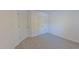 Bright bedroom featuring wall-to-wall carpet and two closets at 916 Woodside Park Ln, Durham, NC 27704