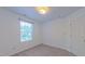Carpeted bedroom featuring a window offering plenty of natural light at 916 Woodside Park Ln, Durham, NC 27704