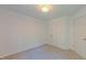 Clean bedroom with neutral carpet and white walls, offering a simple and versatile space at 916 Woodside Park Ln, Durham, NC 27704