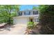 Charming two-story home with a two-car garage and well-maintained landscaping at 916 Woodside Park Ln, Durham, NC 27704