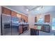 Bright kitchen with stainless appliances and island offers a practical and stylish cooking space at 916 Woodside Park Ln, Durham, NC 27704