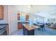 Bright, open-concept kitchen flows into the dining and living areas, featuring an island with ample counter space at 916 Woodside Park Ln, Durham, NC 27704