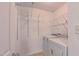 Bright laundry room features a washer, dryer and shelving for extra storage at 916 Woodside Park Ln, Durham, NC 27704