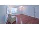 Light-filled living room with hardwood floors, natural light and neutral walls at 916 Woodside Park Ln, Durham, NC 27704