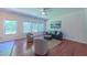 Inviting living room with hardwood floors, a view of the backyard and ceiling fan at 916 Woodside Park Ln, Durham, NC 27704