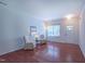 Bright living room featuring hardwood floors, a large window and ample space at 916 Woodside Park Ln, Durham, NC 27704