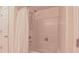 Shower and bathtub combo with white curtain and a hand-held shower head at 916 Woodside Park Ln, Durham, NC 27704