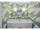 Bright bathroom features vanity and patterned wallpaper at 926 Wimbleton Dr, Raleigh, NC 27609