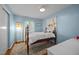 Cozy bedroom with blue walls features a window and rug at 926 Wimbleton Dr, Raleigh, NC 27609