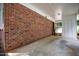 View of the home's brick and concrete carport, offering protected parking at 926 Wimbleton Dr, Raleigh, NC 27609