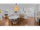 Open dining and kitchen area featuring modern appliances, round table, and a cozy design at 926 Wimbleton Dr, Raleigh, NC 27609