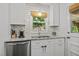 Bright kitchen featuring subway tile backsplash, stainless appliances, and modern cabinets at 926 Wimbleton Dr, Raleigh, NC 27609
