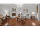 Comfortable living room boasts hardwood floors, fireplace, and neutral decor at 926 Wimbleton Dr, Raleigh, NC 27609