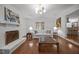 Cozy living room with fireplace, neutral tones, hardwood floors, and french doors at 926 Wimbleton Dr, Raleigh, NC 27609