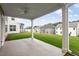 View from the covered back patio onto the spacious lawn and neighborhood at 94 Black Walnut Dr # 201, Garner, NC 27529
